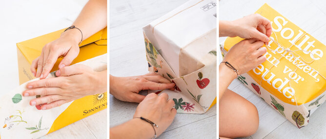 Geschenkpapier | © SONNENTOR Hier sieht man, wie ein Geschenk mit dem Papiertasche Geschenkpapier eingepackt wird. | © SONNENTOR